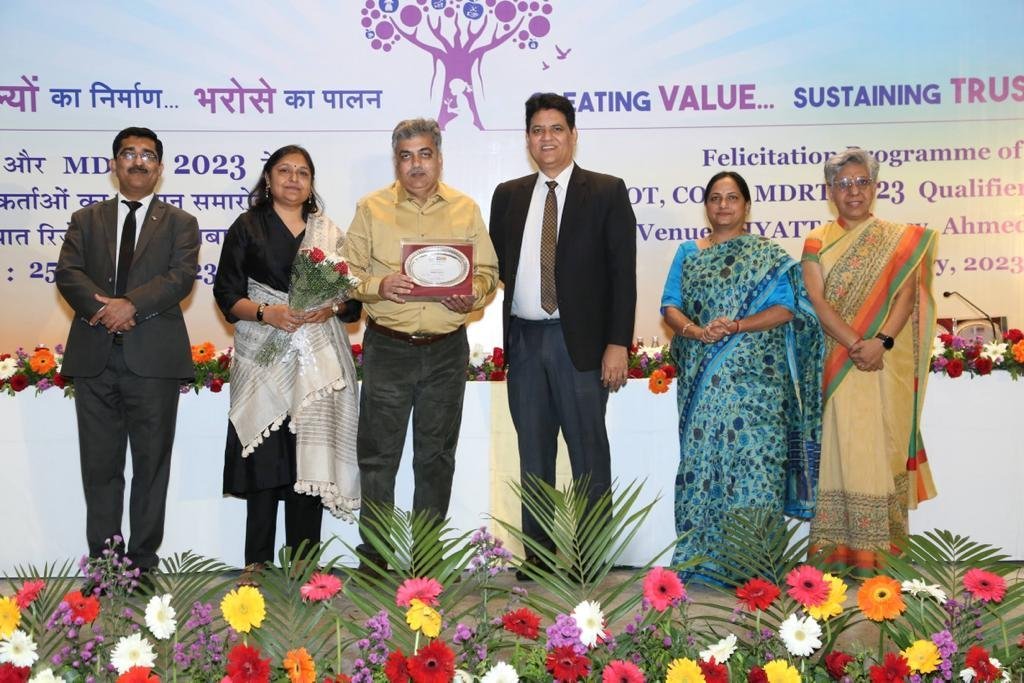 Ashit Shah receiving a memento at a felicitation programme in 2023